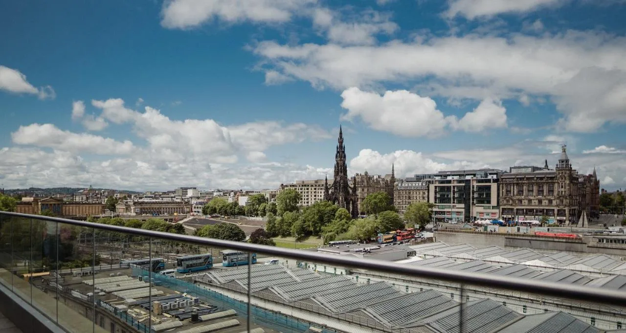 a view of a city from a balcony at Market Street hotel in Edinburgh